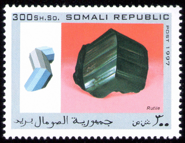 The national postal infrastructure was later completely destroyed during the civil war, with Somali Postal officially suspending operations in October 1991. Postage stamps continued to be produced illegally internationally during the war, although their subject matter suggests they were designed for external collectors. The set of mineral stamps in this album from the Somali republic are examples of hundreds of bogus topical stamps produced up to 2013. The Universal Postal Union is now assisting the reestablished Somali Postal Service to develop its capacity, including providing technical assistance and basic mail processing equipment. In October 2014, the Ministry of Posts and Telecommunications also relaunched postal delivery from abroad. The postal system is slated to be implemented throughout the country via a new postal coding and numbering system. According to the Minister of Posts and Telecommunications Mohamud Ibrihim Adan, the relaunch's next phase will enable local residents to send letters to acquaintances overseas.
Source: https://en.wikipedia.org/wiki/Postage_stamps_and_postal_history_of_Somalia Somali-Republic-1997-Rutite.jpg